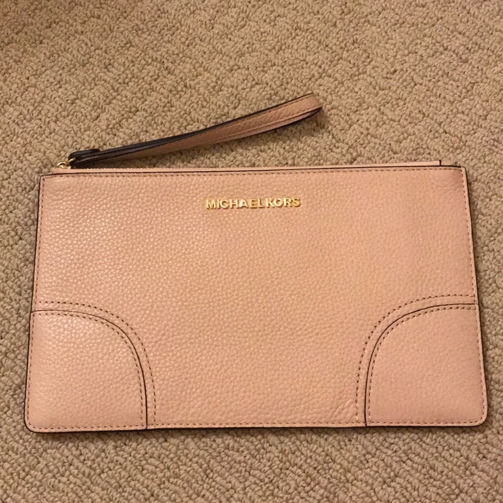 Brand new Michael Kors clutch with tags